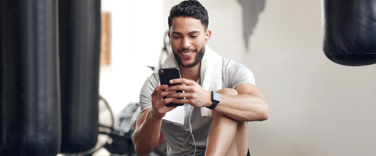 photo of a man starting a virtual personal training session on his mobile phone