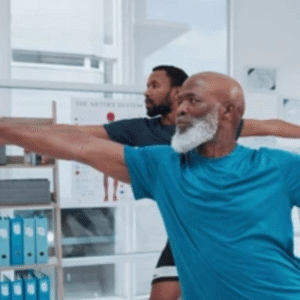 two men stretching in office setting for workplace wellness